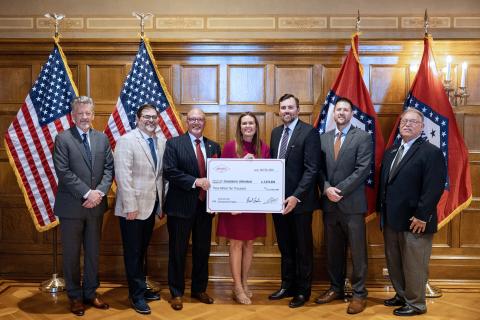 JU VP of Economic Development Steven Lamm, Jonesboro Mayor Harold Copenhaver, and Governor Sarah Sanders hold a large check for $3,010,000